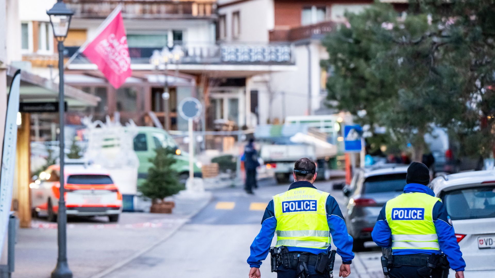 Police officers walk at the site of an explosion that ripped through the bar Le Constellation in Crans-Montana on January 1. /Maxime Schmid/AFP