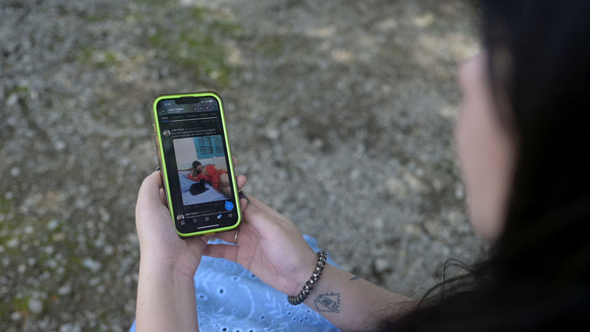 Julie Yukari, a musician based in Rio de Janeiro, discovered that Grok had generated nearly nude images of her when users requested edits to a photo she posted. /Tita Barros/Reuters
