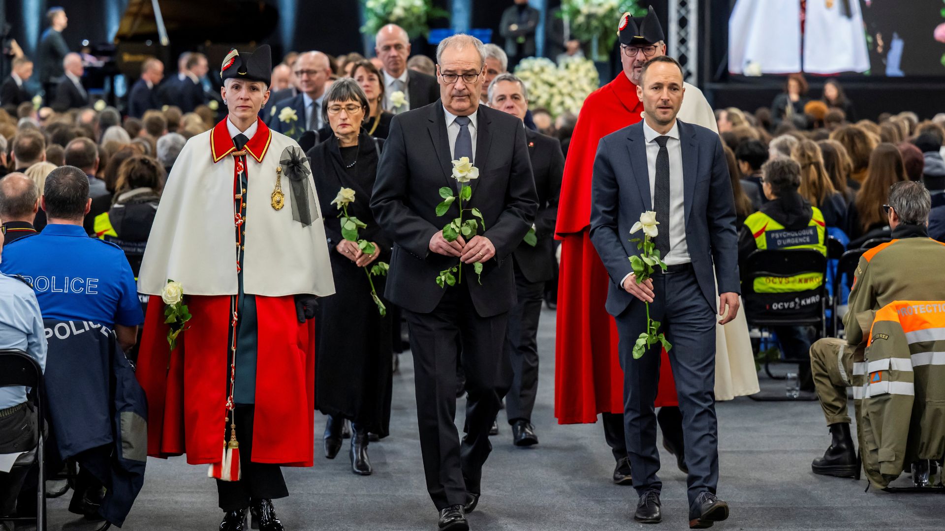 Swiss Federal President Guy Parmelin and Mathias Reynard, State Councillor and president of the Council of State of the Canton of Valais at the ceremony. /Laurent Gillieron/Reuters