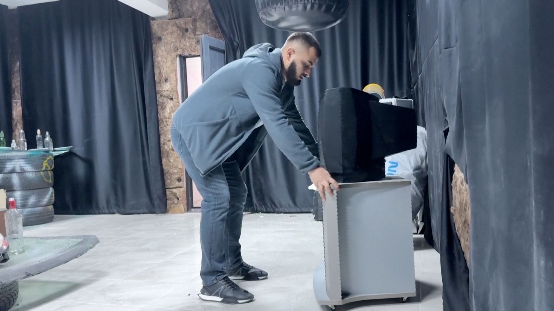 Owner Hamza Durmaz prepares the room for the next visitors. /Reuters