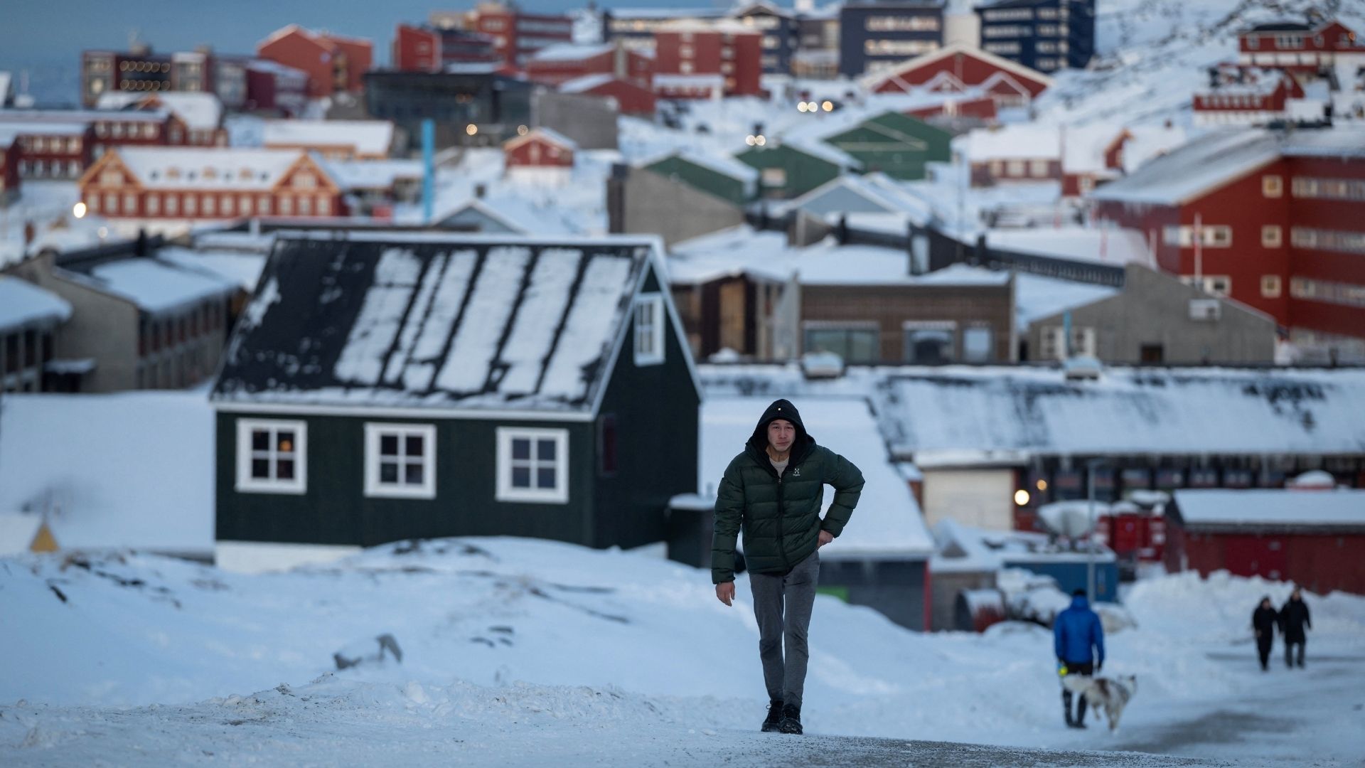 A man walks along a road on the day of the meeting between top U.S. officials and the foreign ministers of Denmark and Greenland, in Nuuk on January 14. /Marko Djurica/Reuters
