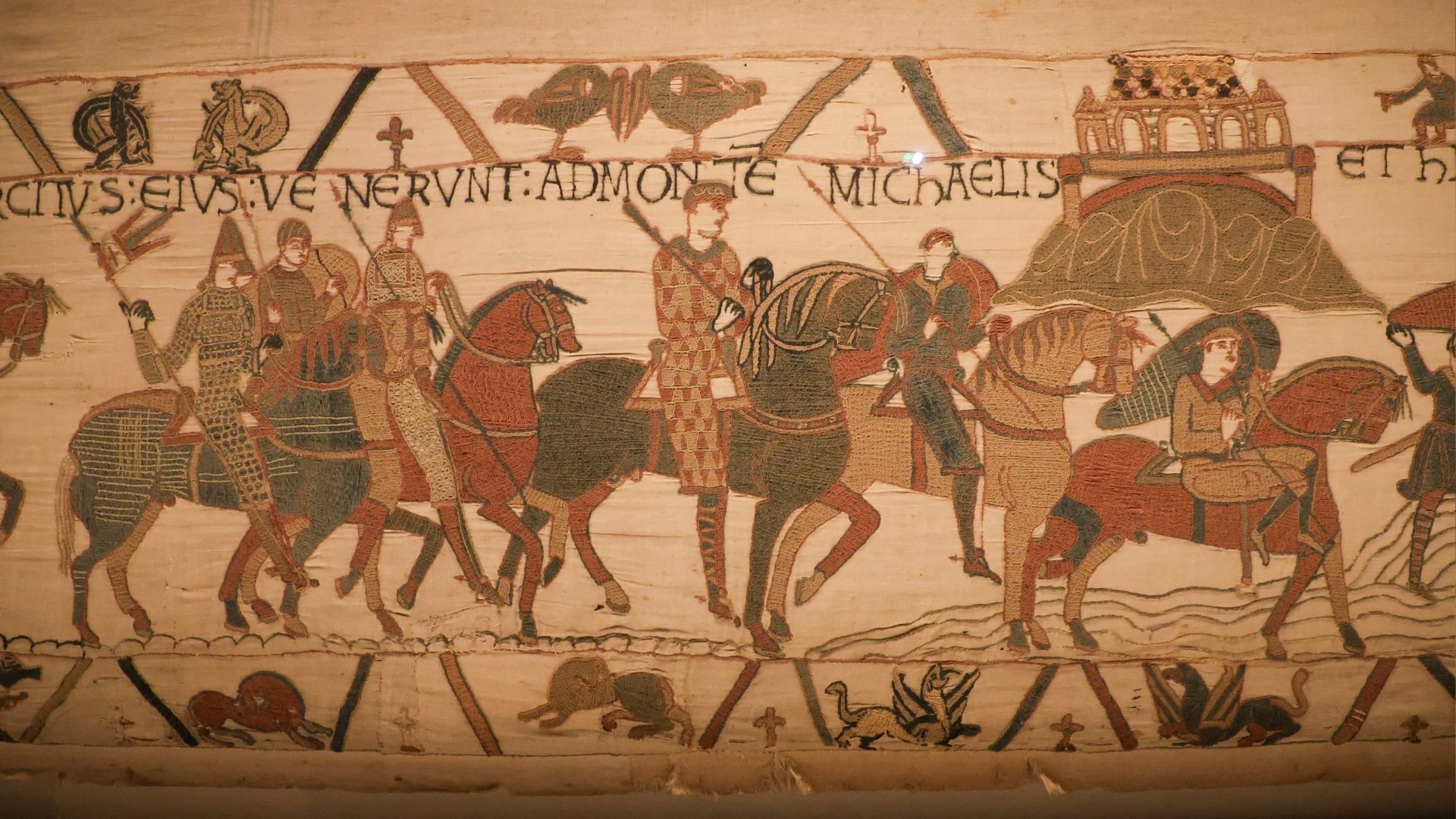 A scene on the Bayeux Tapestry depicts horsemen and Mont Saint-Michel, believed to be one of the earliest known visual representations of the French landmark. /Ardee Napolitano/Reuters
