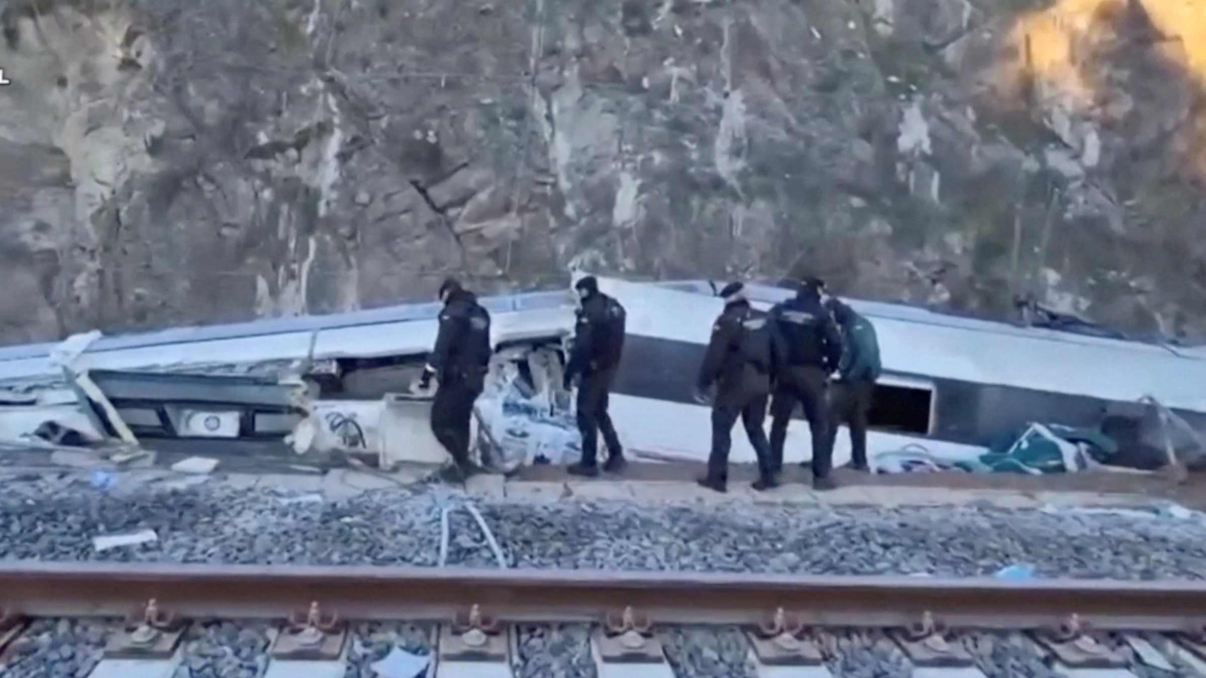 Emergency personnel inspect the site of the deadly train collision in Cordoba. /Guardia Civil/Reuters 