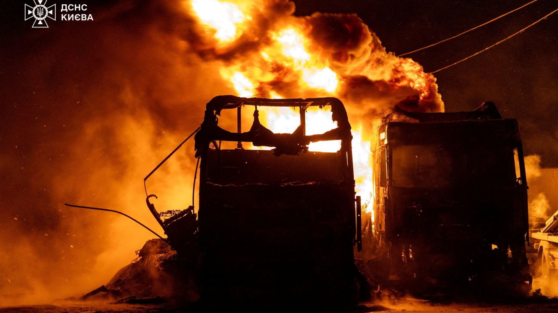 Trucks burn at the site of a Russian drone and missile strike, amid Russia's attack on Ukraine, in Kyiv, Ukraine in this handout picture released January 24, 2026. Press service of the State Emergency Service of Ukraine in Kyiv