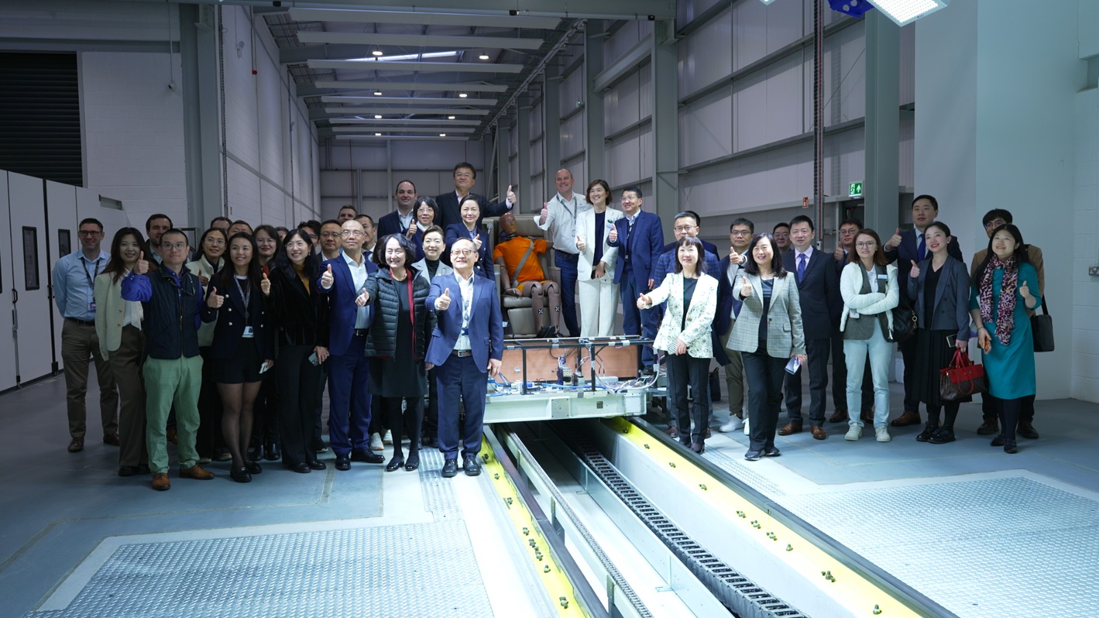 A recent visit from a Chinese delegatioin to Engineers the Thompson Aero Seating dynamic test center. /CGTN