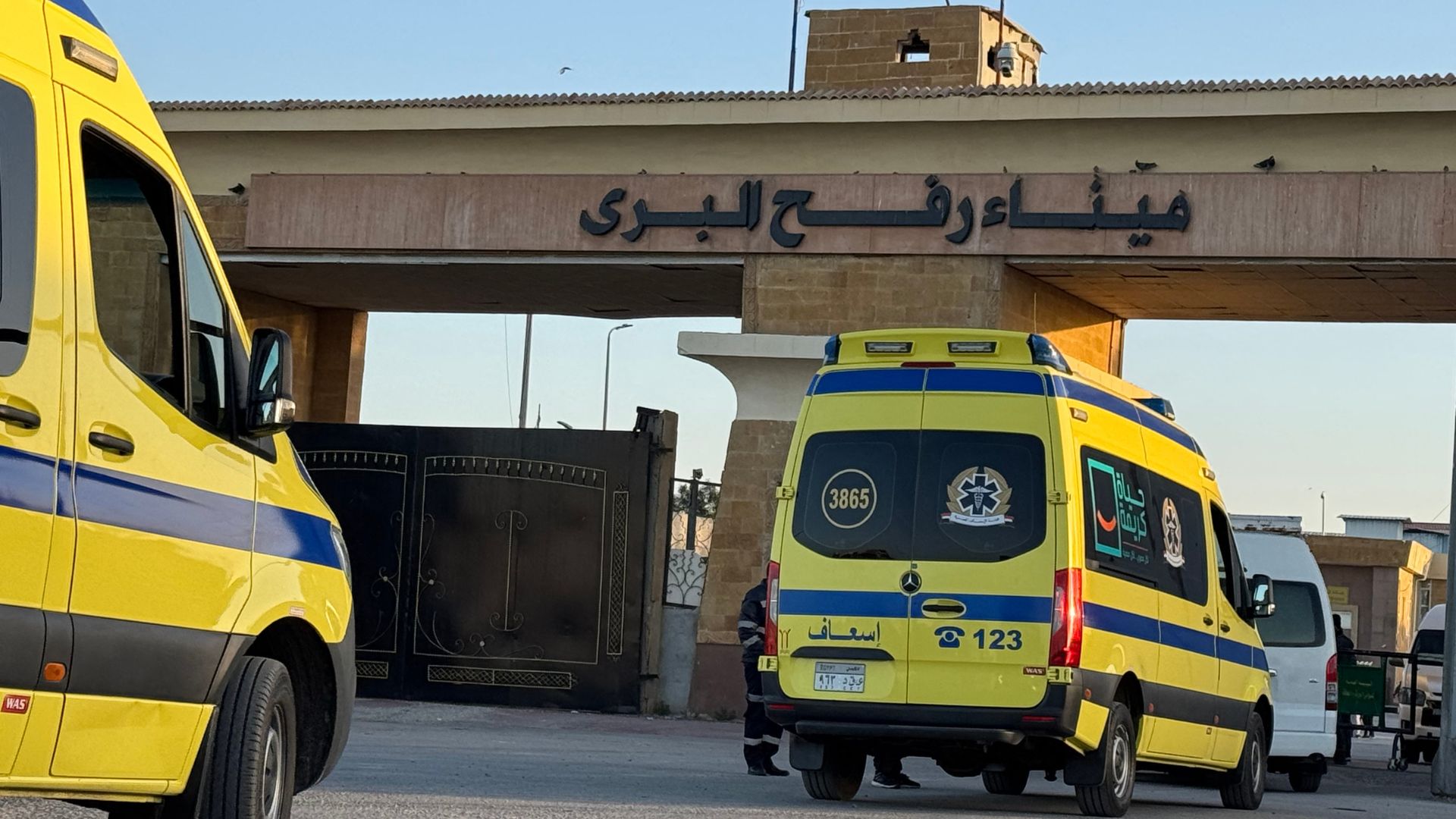 Ambulances wait in line at the Egyptian side of the Rafah border crossing with the Palestinian Gaza Strip on Monday. /STR/AFP