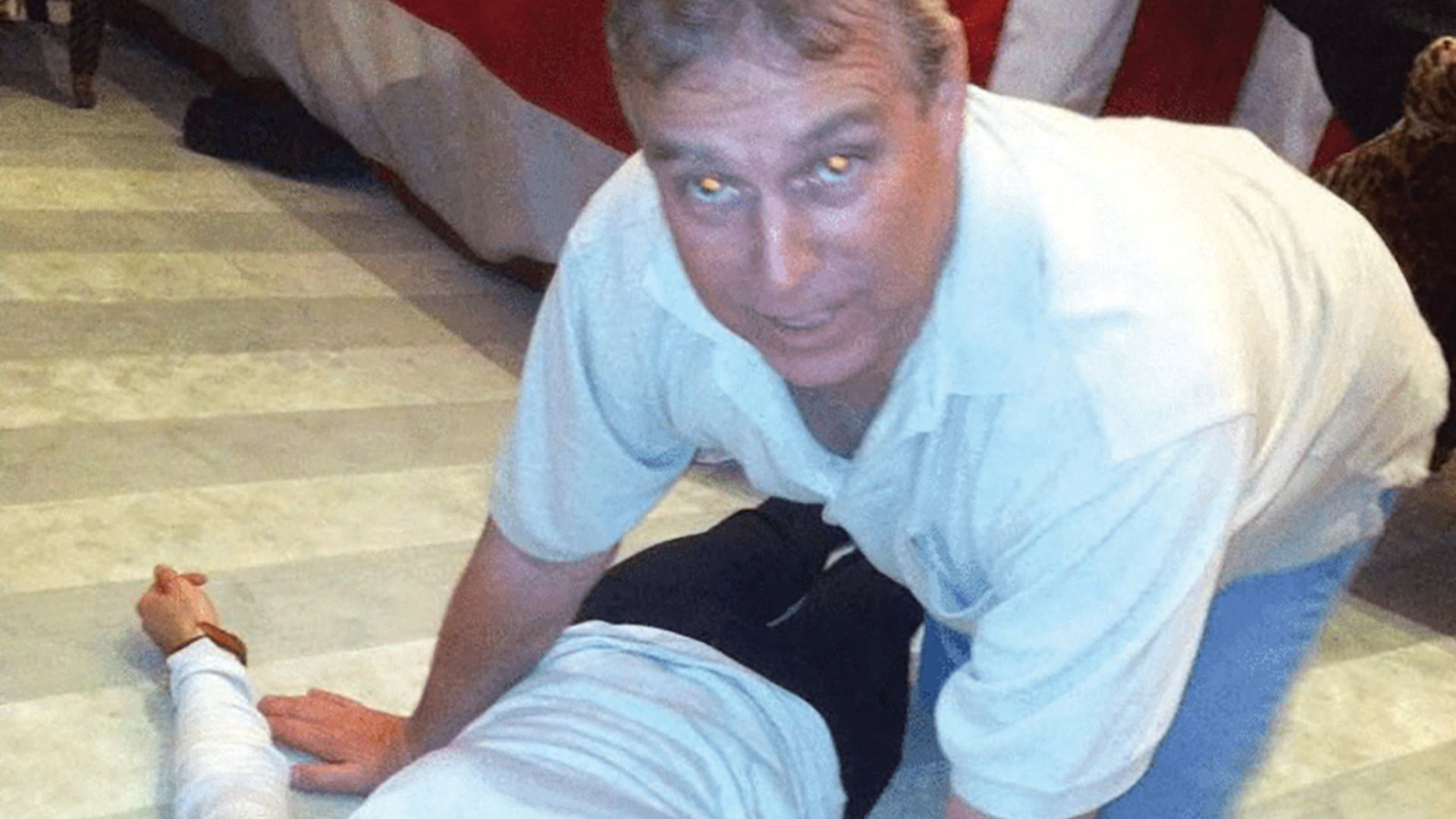 Britain's Prince Andrew kneels over a female in this image released by the Department of Justice on January 30. /US Justice Department/Handout via Reuters
