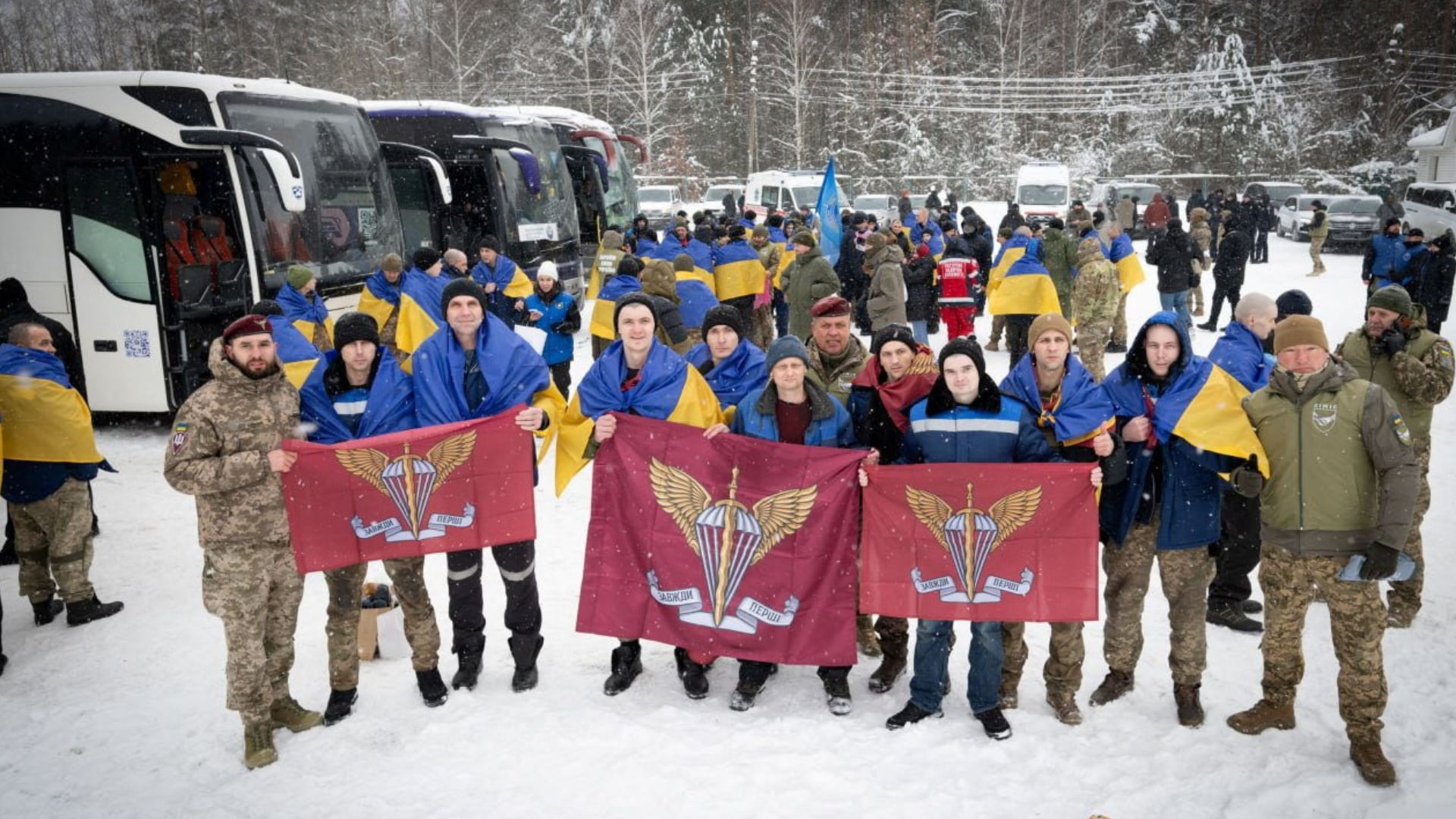Ukrainian prisoners of war (POWs) pose for a picture as they arrive in Ukrainian territory after a swap on February 5. /Ukrainian Presidential Press Service/Handout
