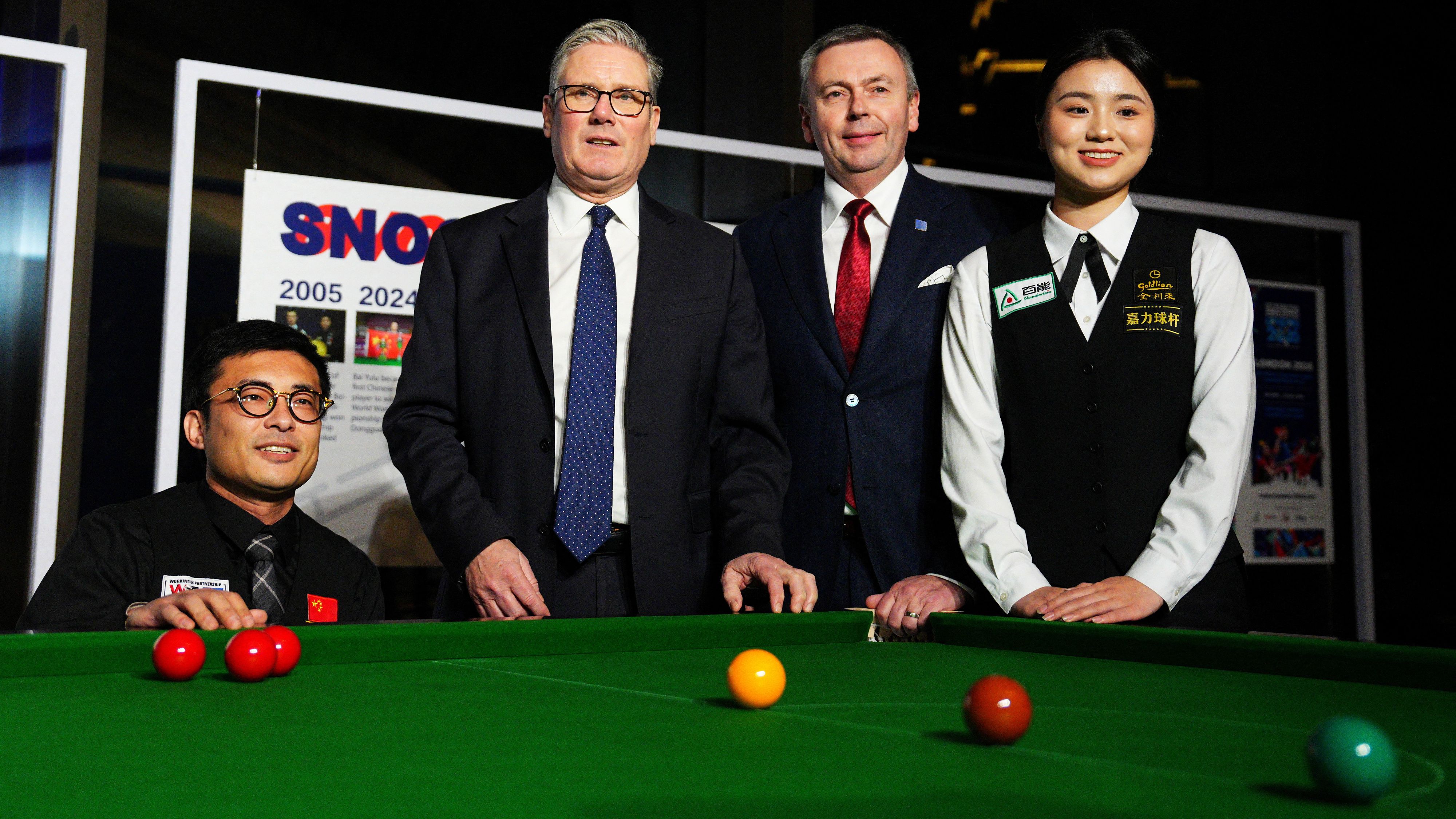 UK Prime Minister Keir Starmer with Jason Ferguson and snooker star Bai Yulu in Shanghai in January. /Carl Court/Reuters