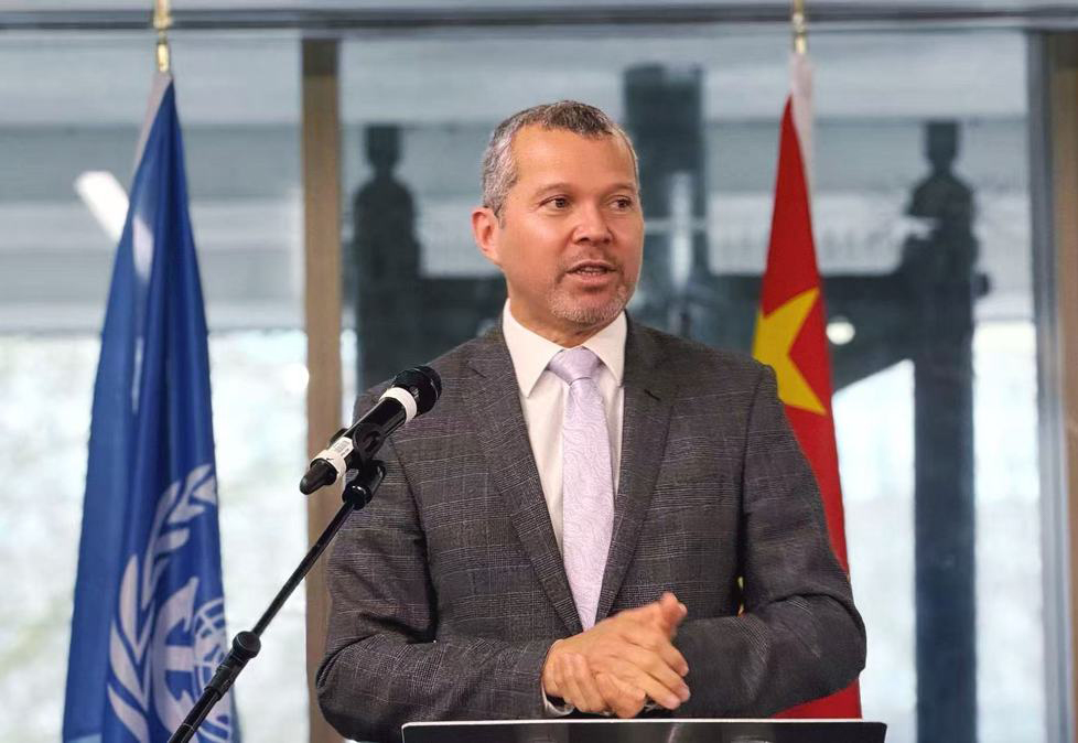 Secretary General Arsenio Dominguez is speaking at the Spring Festival reception at IMO in London, UK. /Photo by China Daily