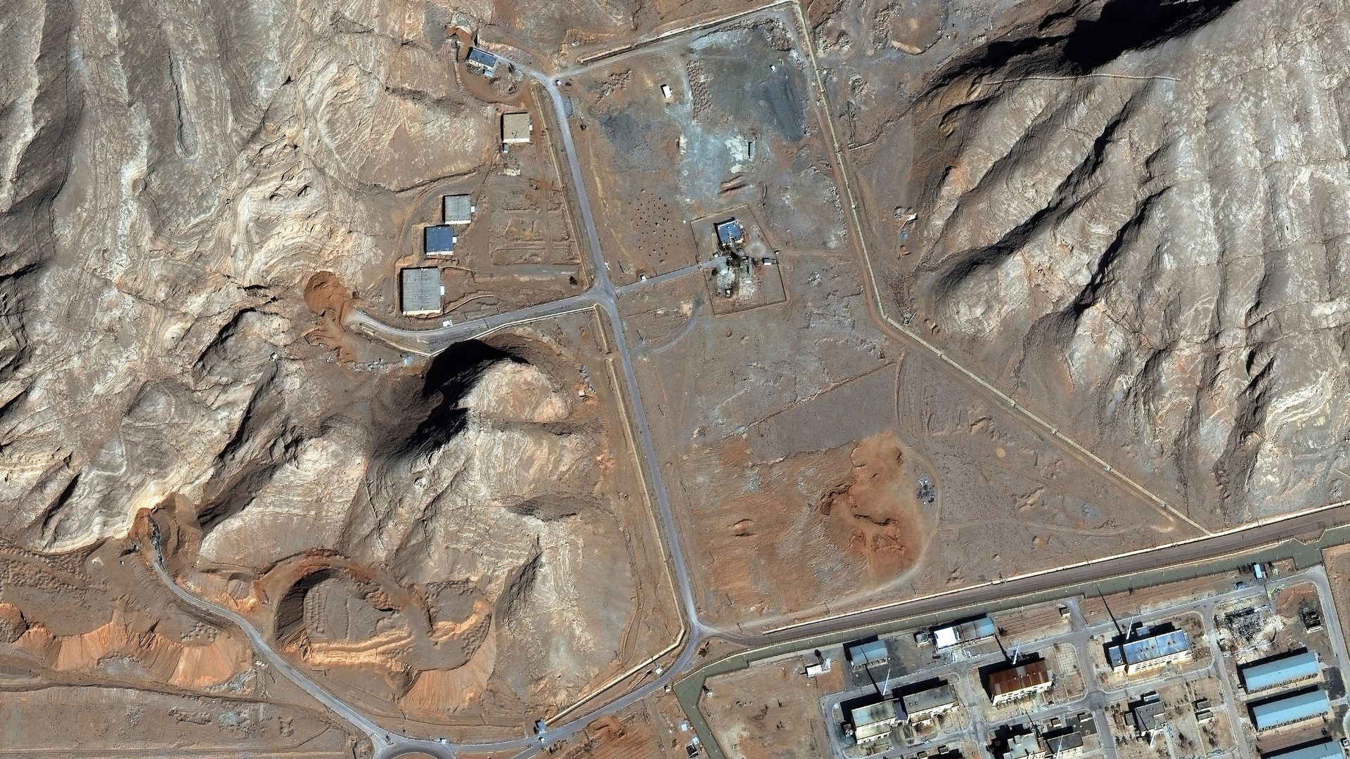 A satellite image shows tunnel entrances covered with soil at Isfahan nuclear complex, in Isfahan, Iran, February 10, 2026. Vantor/Handout 

