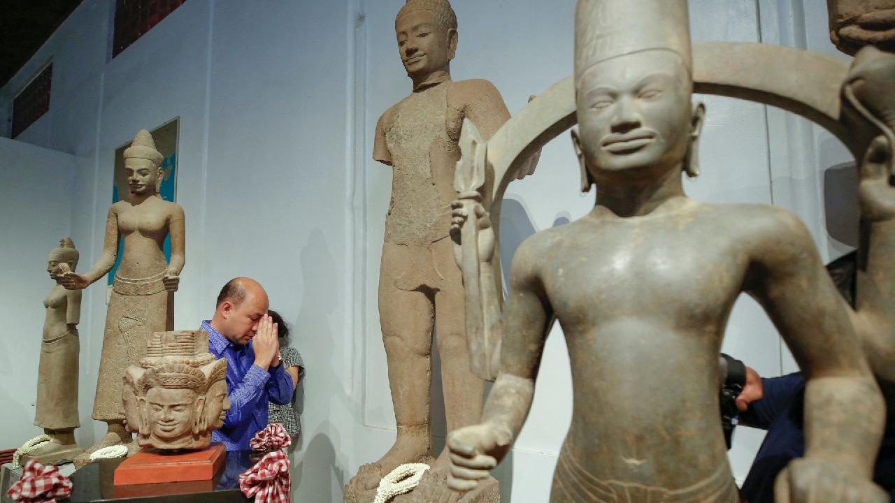 Cambodia welcomes back dozens of artifacts looted by UK trafficker