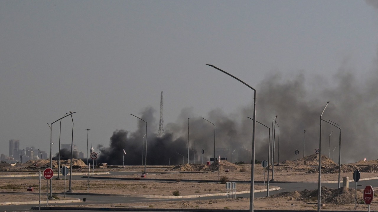 Smoke rises from a reported Iranian strike in the area where the US Embassy is located in Kuwait City. /AFP