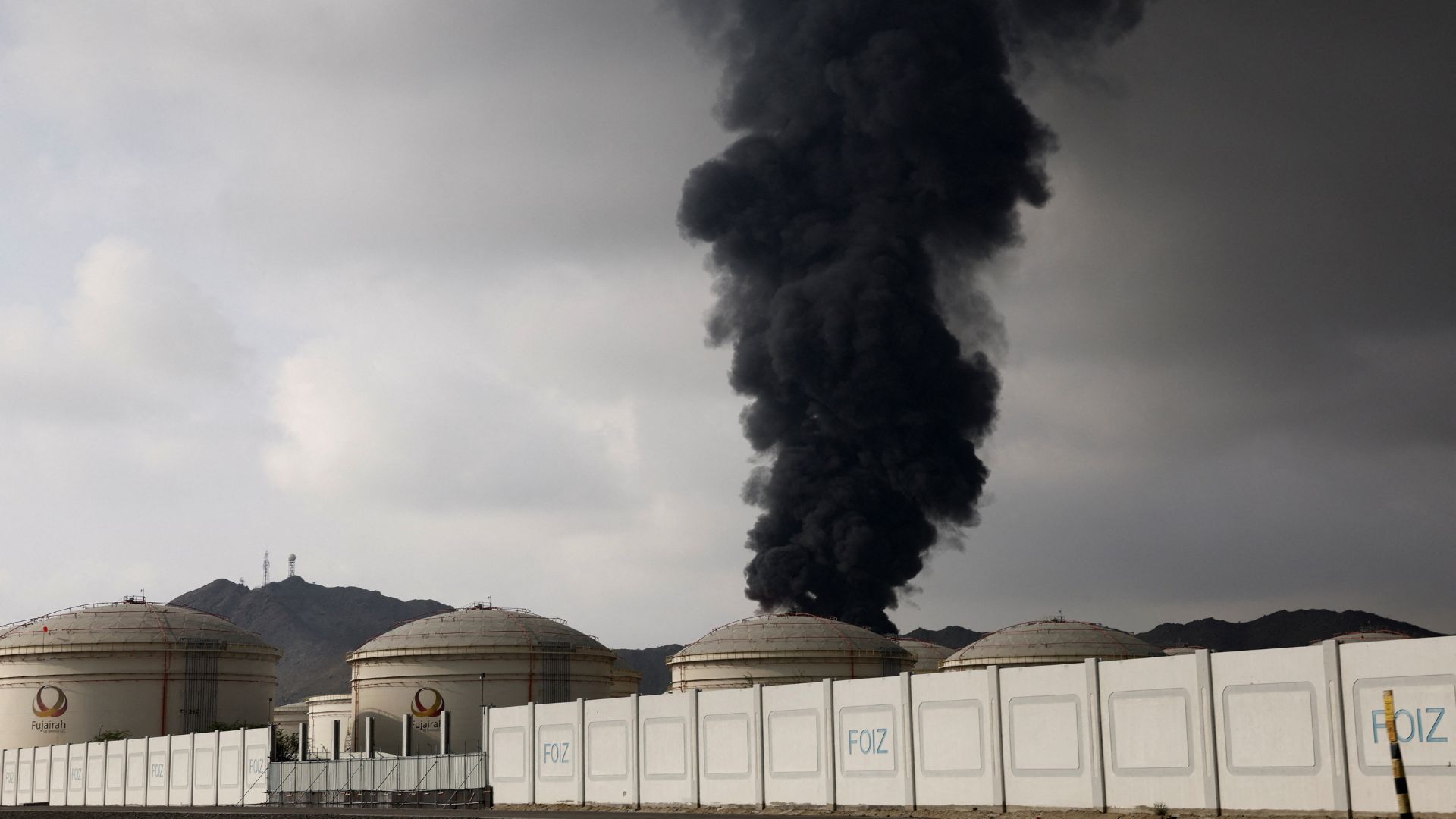 Smoke rises in the Fujairah oil industry zone following a fire caused by debris after interception of a drone by air defenses, according to the Fujairah media office, in Fujairah, UAE on March 4. /Amr Alfiky/Reuters

