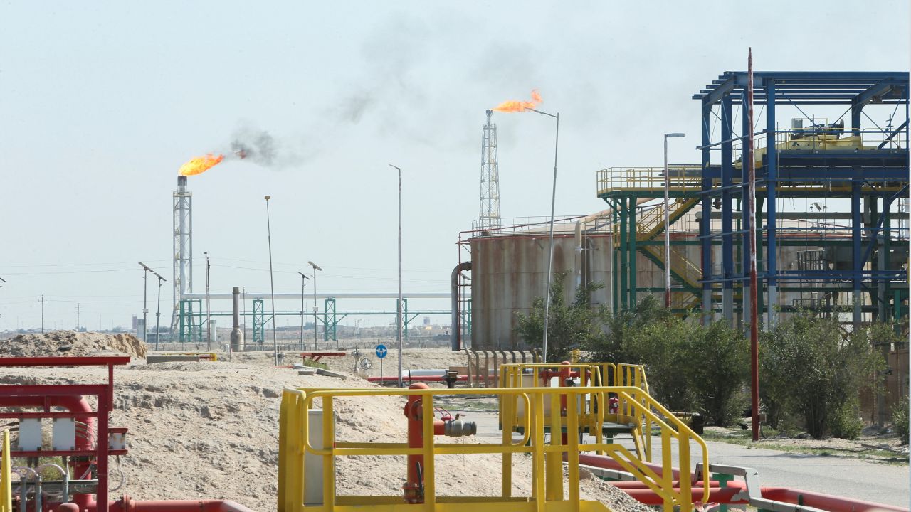Flames rise from a gas flare at the Rumaila oil field in Basra, Iraq, as the country cuts nearly 1.5 million barrels per day of output amid halted exports following the closure of the Strait of Hormuz. /Essam Al-Sudani/Reuters
