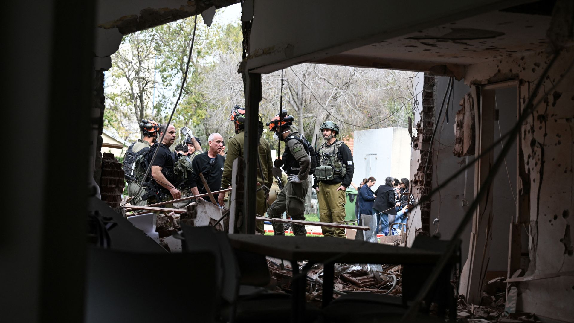 Rescue and security personnel work in northern Israel following projectile barrages from Hezbollah in Lebanon. /Rami Shlush/Reuters
