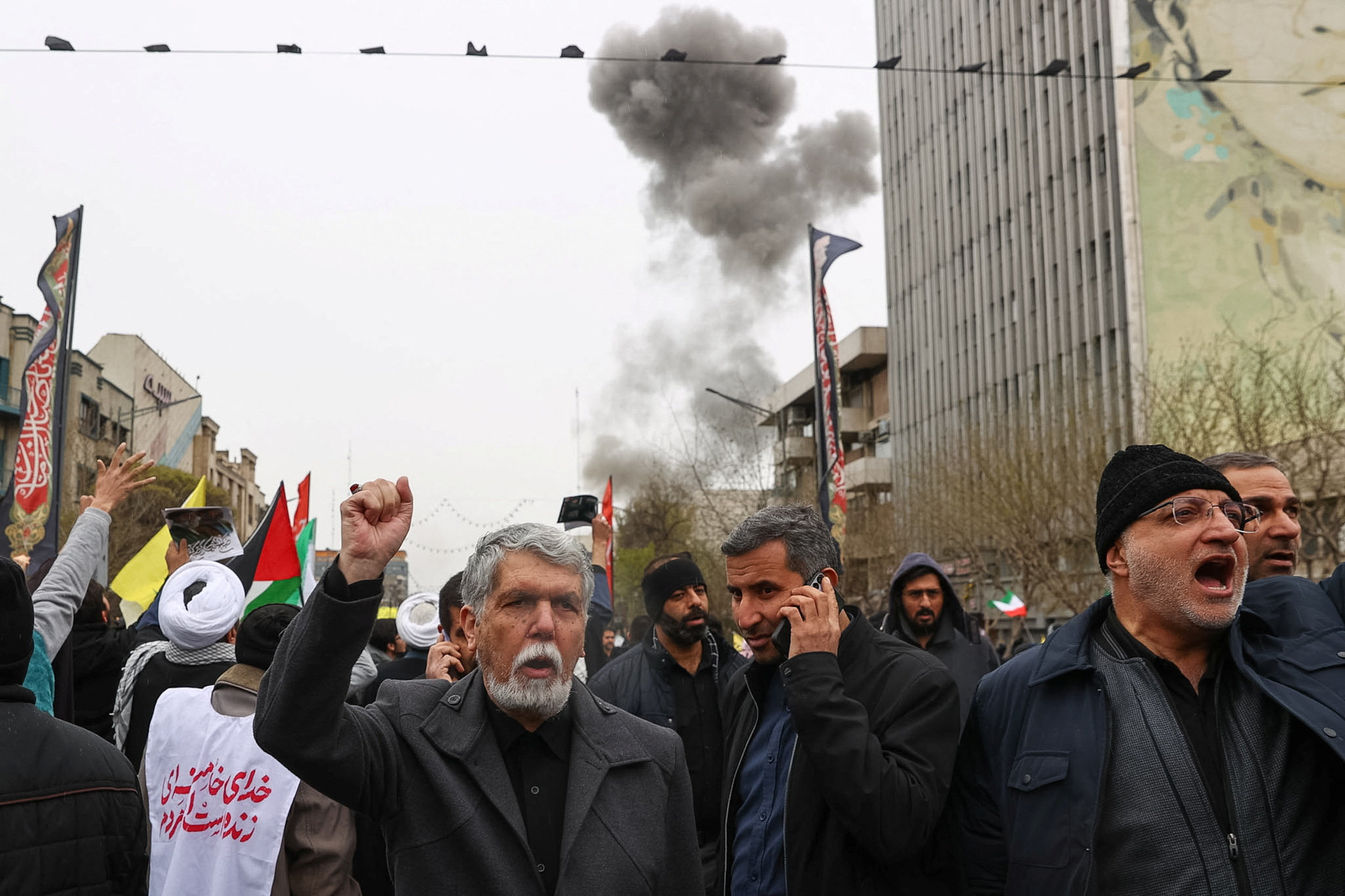 Smoke rises following an explosion during a protest in Tehran on Friday. /Mohammad Mahdi Dehghani/Fars News/WANA/Reuters
