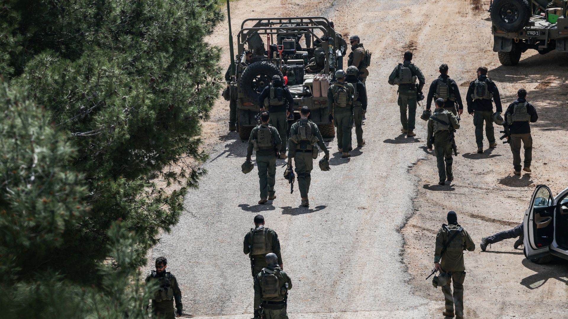 Israeli soldiers gather on the Israeli side of the border with Lebanon on Monday. /Shir Torem/Reuters
