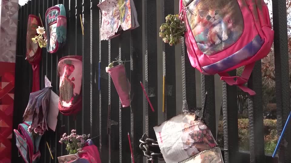 A memorial at Tehran University to the victims of a strike that hit the Shajareh Tayyebeh girls school, featuring pencils, rucksacks, pencil cases and other belongings. /WANA/Reuters