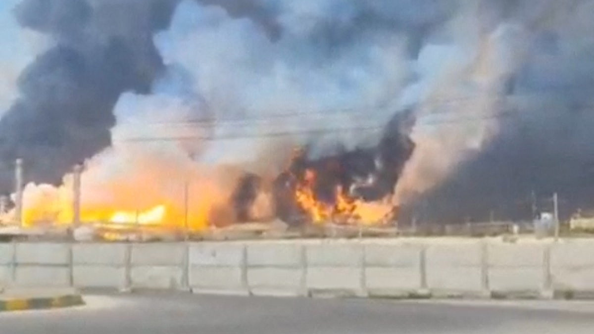 Smoke and fire rise near the South Pars gas field following an attack, amid the U.S.-Israeli conflict with Iran, in Bushehr Province, Iran. /Reuters