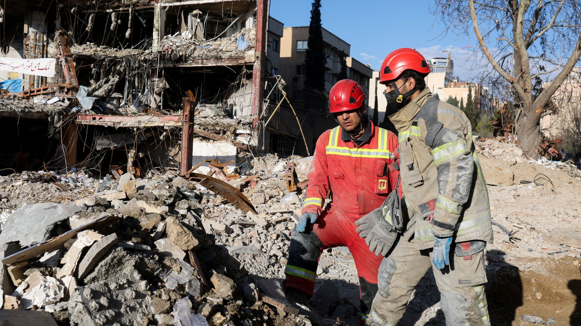 Members of a Red Crescent rescue team work at a building that was damaged by a strike, amid the US-Israeli conflict with Iran, in Tehran, Iran./ Alaa Al-Marjani/Reuters
