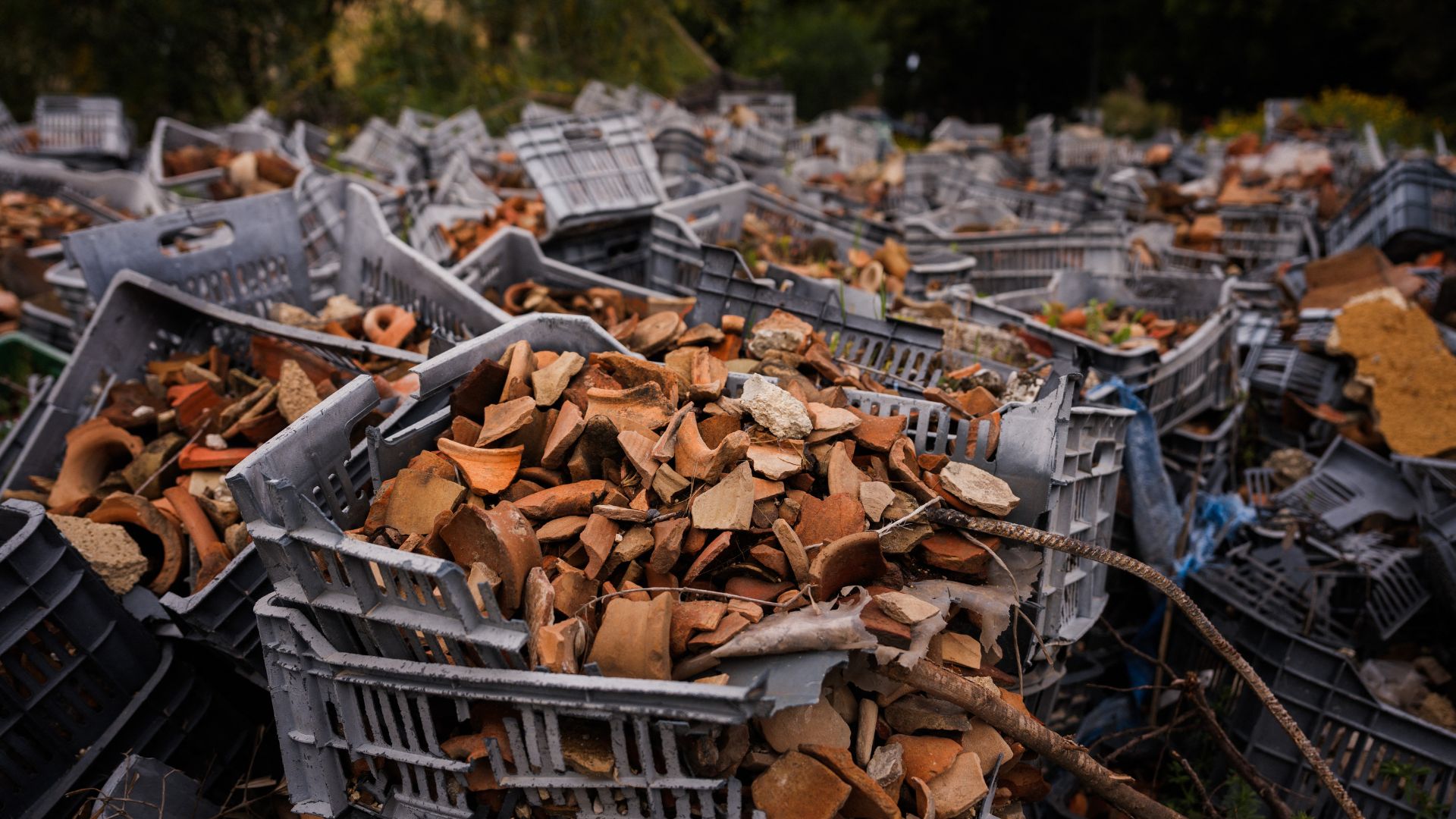 Boxes filled with fragments of ancient pottery collected after an Israeli strike near the archeological site of the Roman hippodrome in Tyre. /Dimitar Dilkoff/AFP