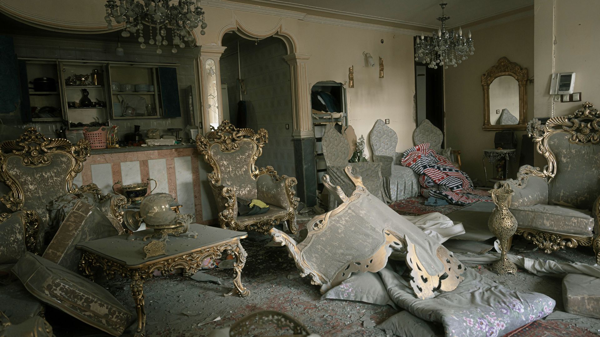 A damaged living room is seen in a house that was affected when a nearby residential building was hit in an overnight strike during the US-Israeli military campaign in Tabriz, East Azerbaijan Province, northwestern Iran, Tuesday. /AP/Matin Hashemi
