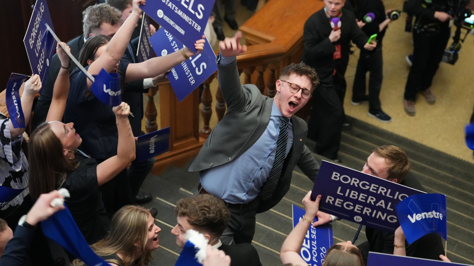 Members of the conservative liberal Venstre party react after the General Election in the Danish Parliament in Copenhagen, Denmark, Tuesday, March 24. /AP/Sergei Grits