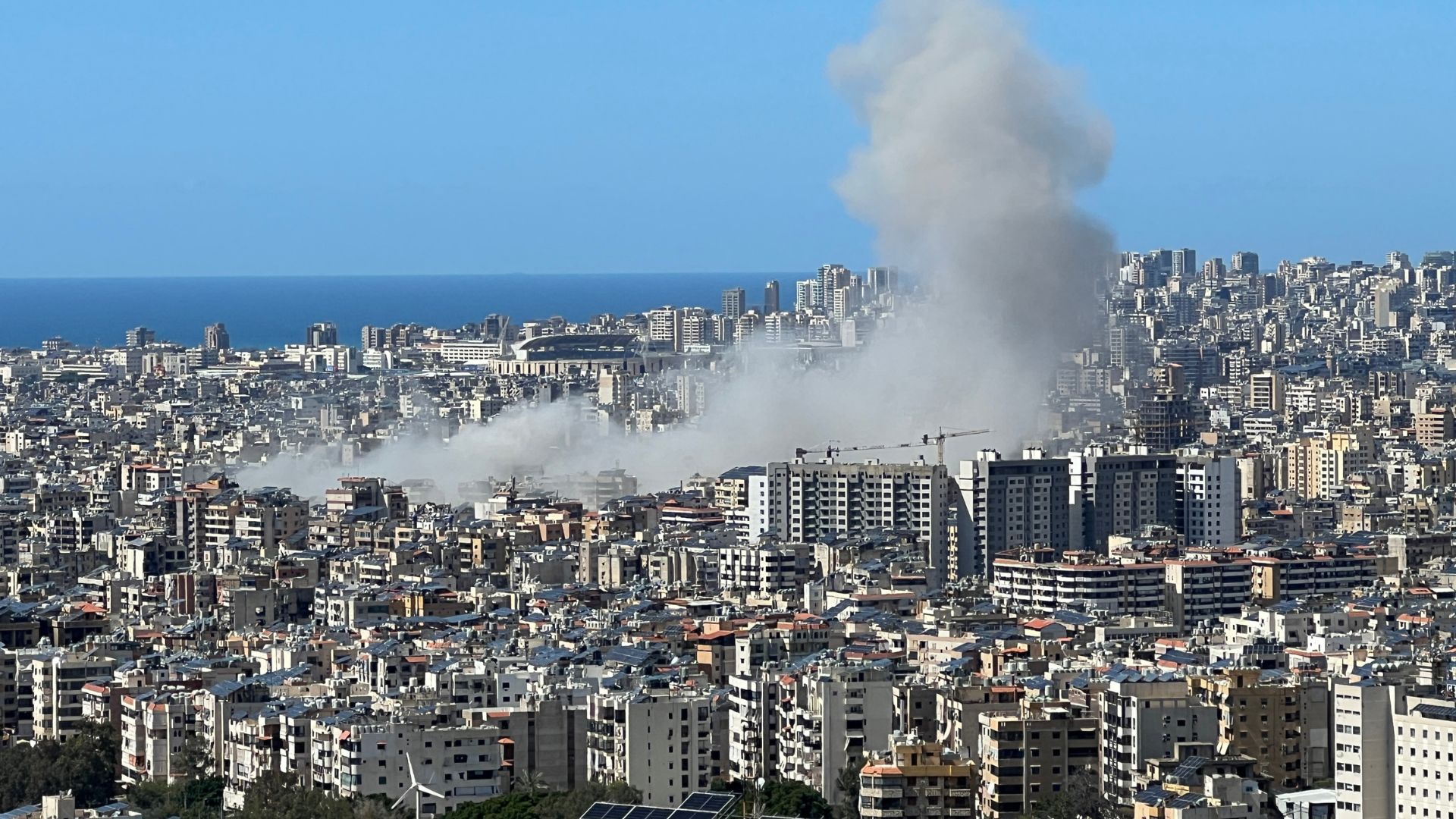 Smoke rises from the site of an Israeli airstrike in Beirut's southern suburbs on March 31. /Kamal Mehanna/AFP

