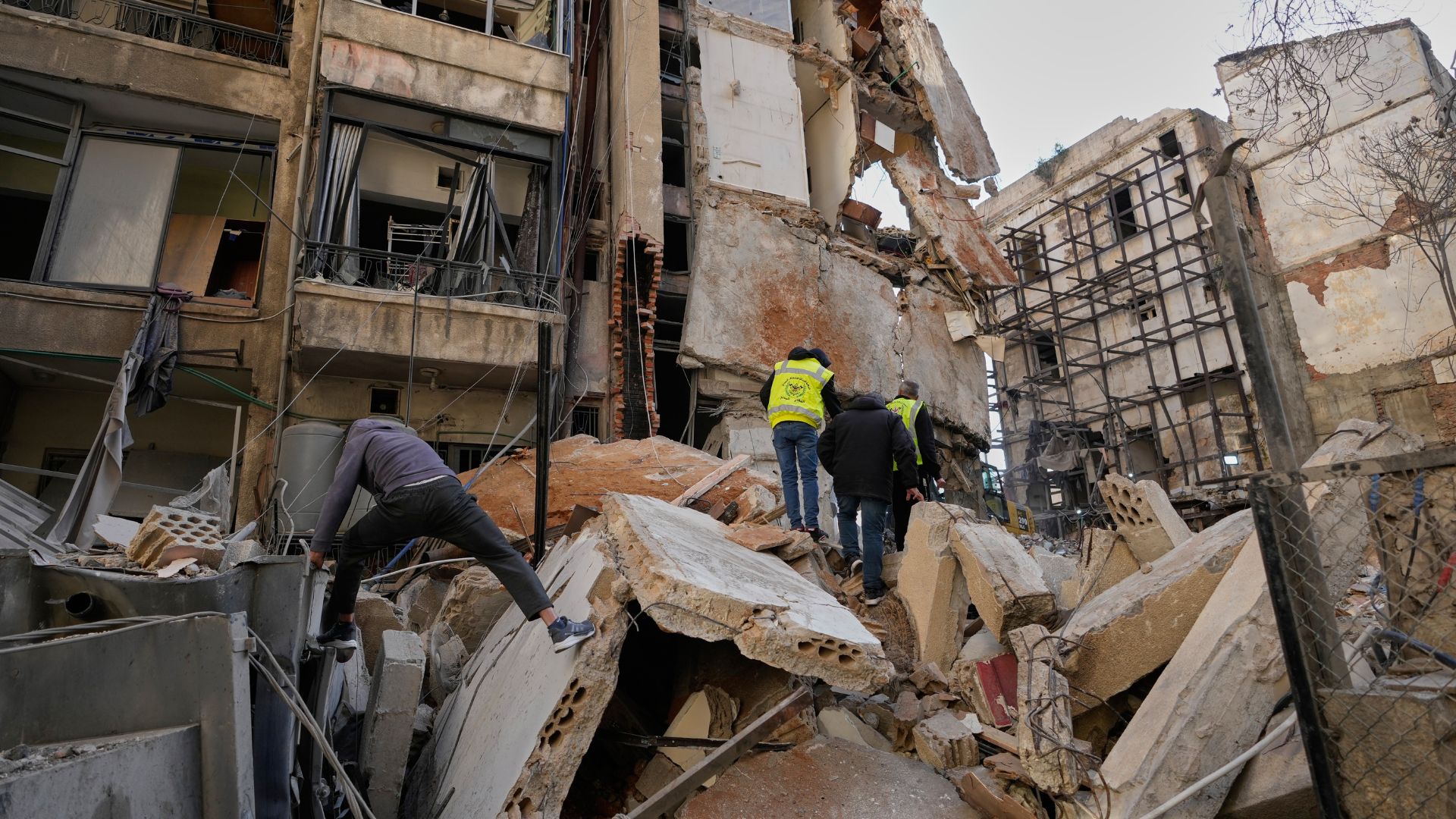 People inspect the rubble of a building destroyed in an Israeli airstrike a day earlier in Beirut, Lebanon, on April 9. /Hussein Malla/AP
