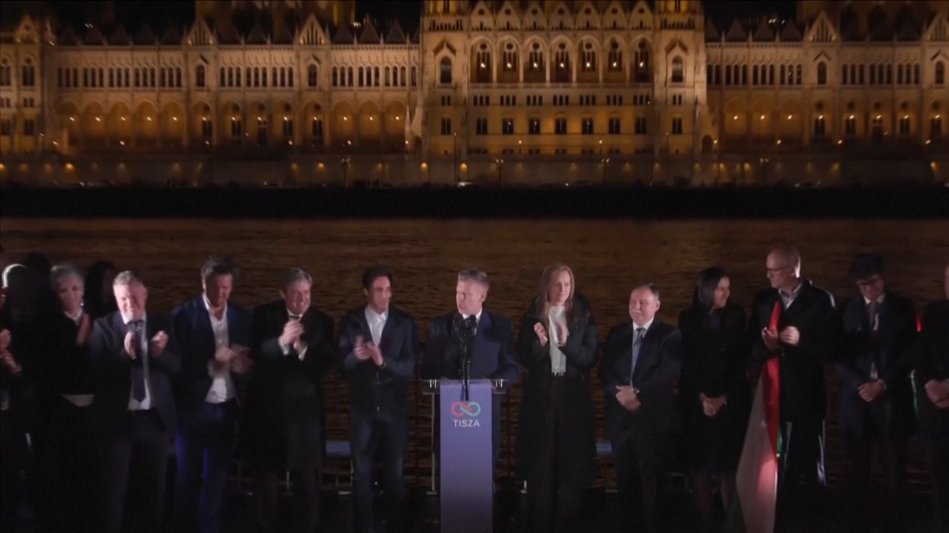 Peter Magyar (center) and Tisza politicians celebrate at a party by the Danube. /Tisza/Reuters