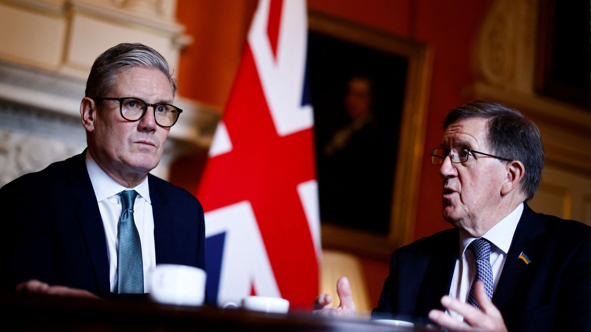 Britain's Prime Minister Keir Starmer (L) listens to Member of the House of Lords George Robertson (R) during a meeting at 10 Downing Street in London on July 16, 2024. /Benjamin Cremel/Pool