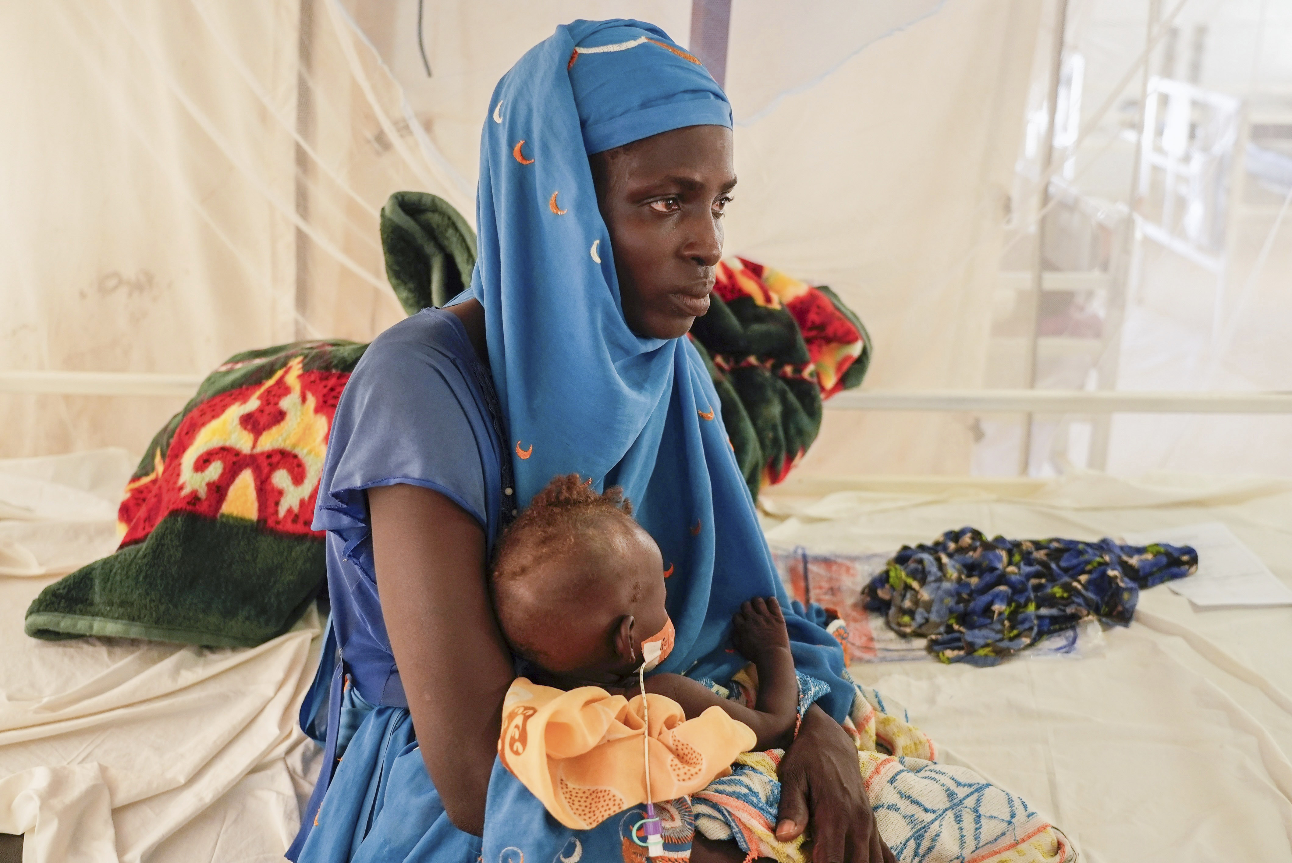 Halima Habdullha holds her 7-month-old severely malnourished daughter Kaltum Abakar in an MSF-run clinic in the Aboutengue displacement site near Acre, Chad, Friday, Oct 4. 2024. /Sam Mednick/AP Photo