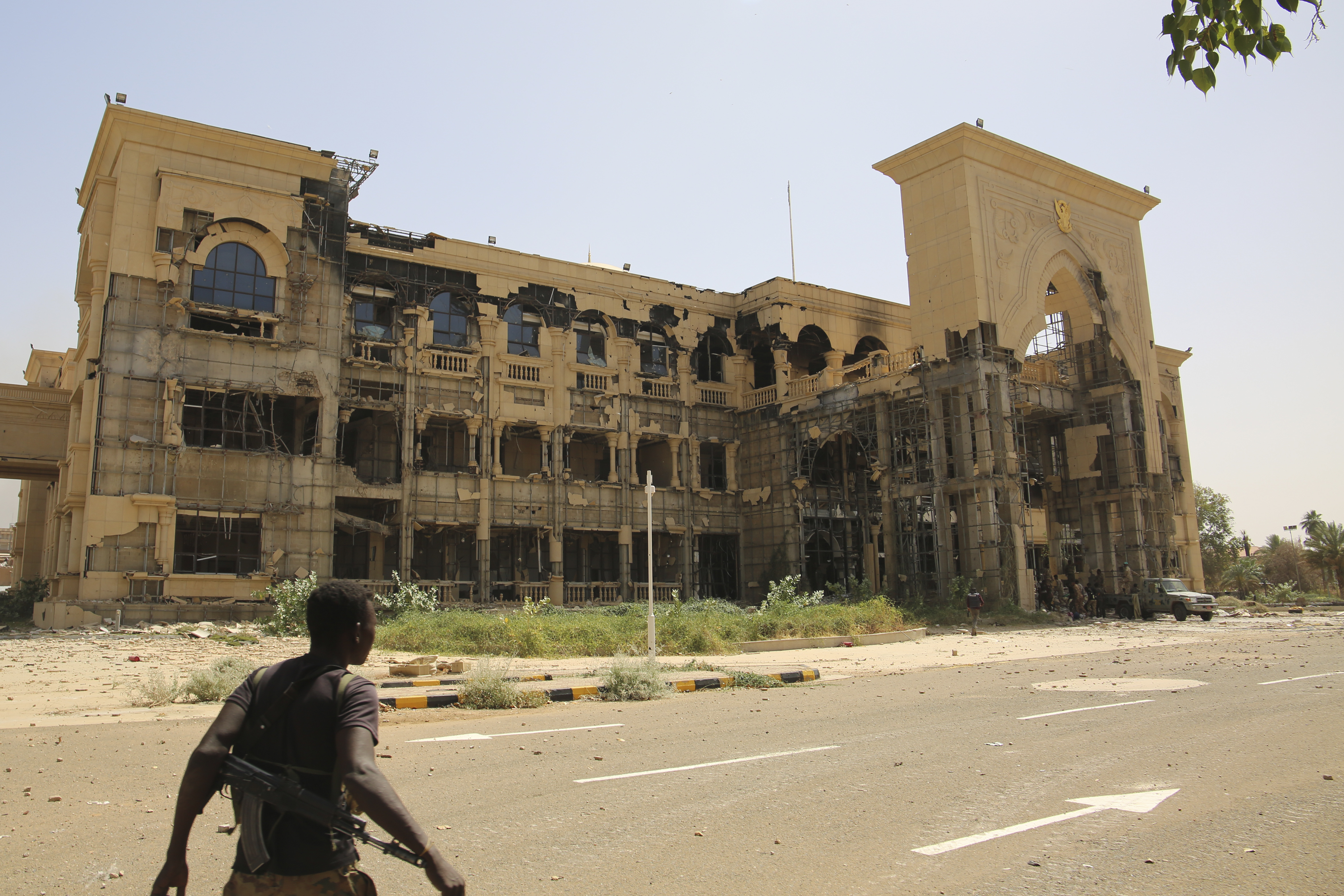 An army soldier walks in front of the Republican Palace in Khartoum, Sudan, after it was taken over by Sudan's army, March 21, 2025. /AP Photo