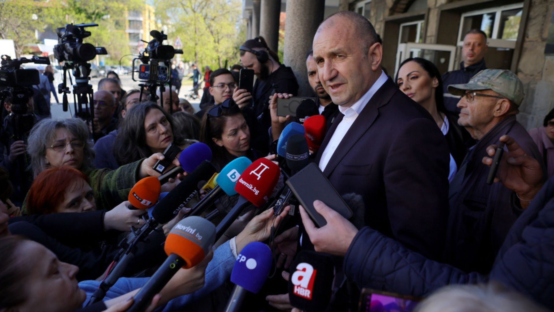 Former Bulgarian President Rumen Radev speaks after casting his vote at a polling station in Sofia on Sunday./ Valentina Petrova/AP
