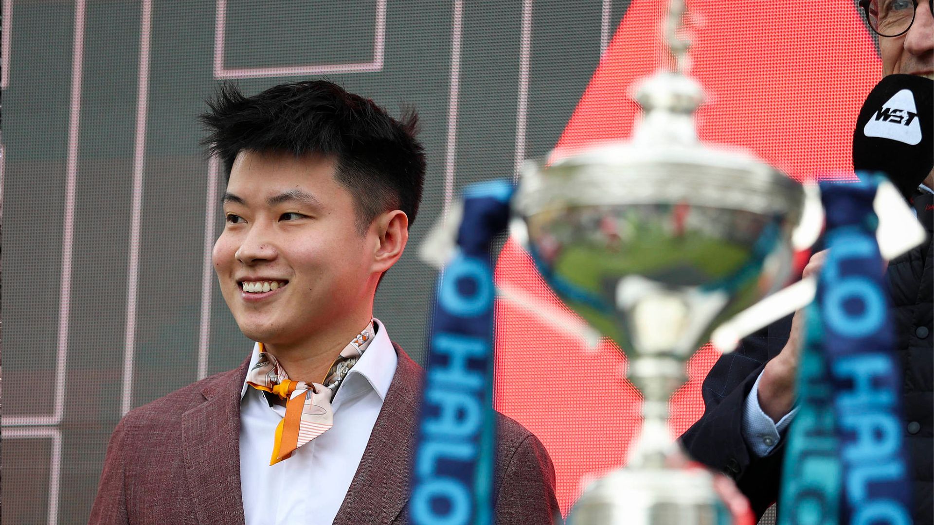 Zhao Xintong next to the World Championship trophy he lifted last year at last week's Sheffield media day event. /Phil Duncan/Every Second Media
