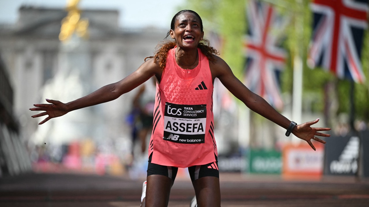 Ethiopia's Tigst Assefa reacts after crossing the line to win the women's race in a new women's only world record at the 2026 London Marathon in central London. /Justin Tallis/AFP