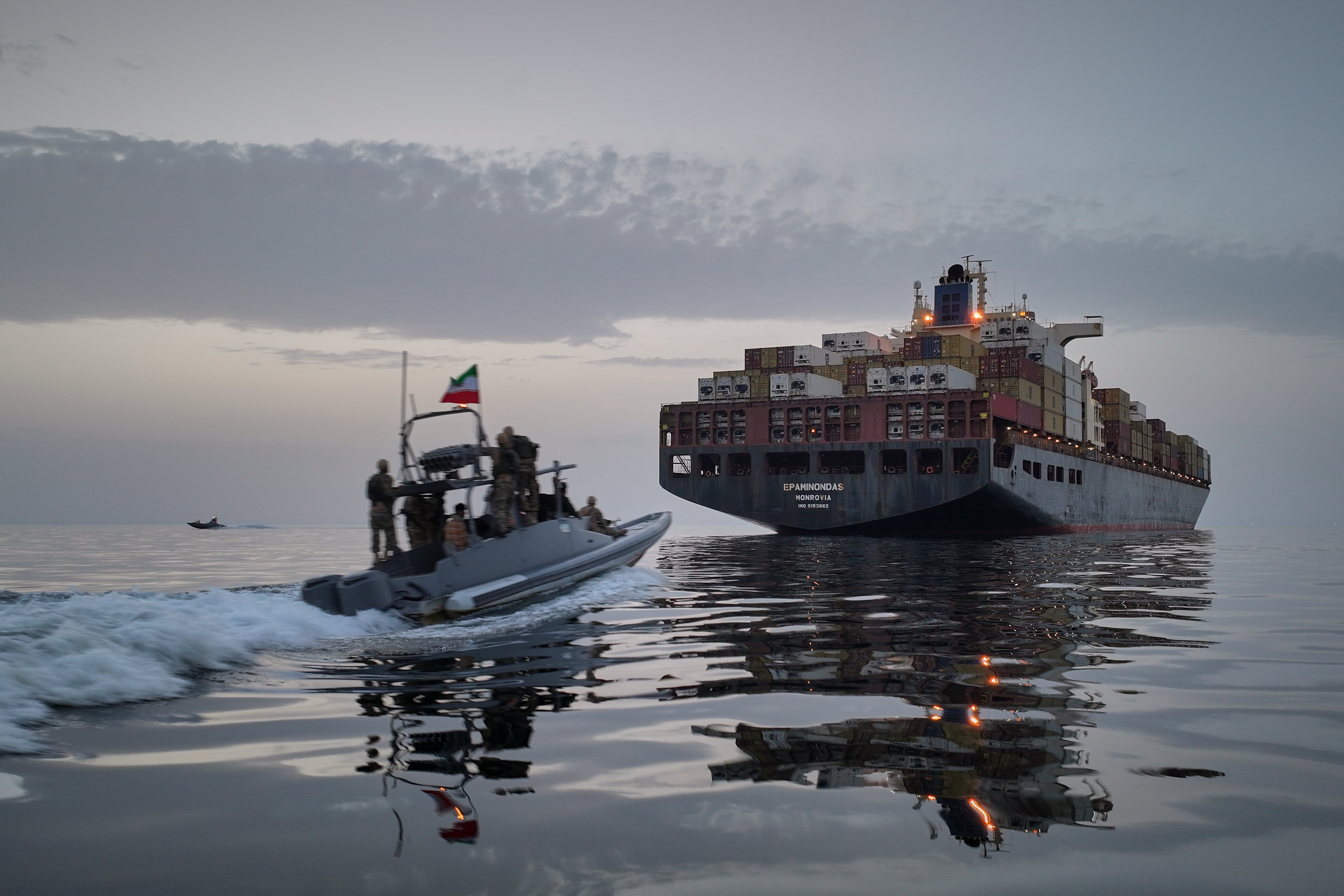A Revolutionary Guard Navy (IRGC) speedboat approaches the cargo ship Epaminondas during what state media described as the seizure of one of two vessels accused of violations in the Strait of Hormuz, on April 21. /Meysam Mirzadeh/Tasnim News Agency via AP, File)