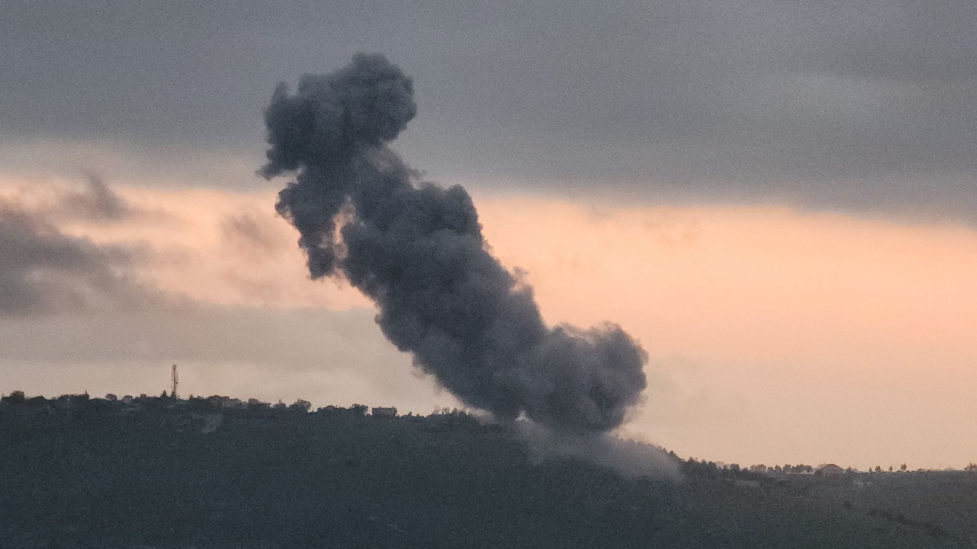 Smoke rises from the site of explosions conducted by Israeli troops in the southern Lebanese village of Arnoun on April 28. /AFP
