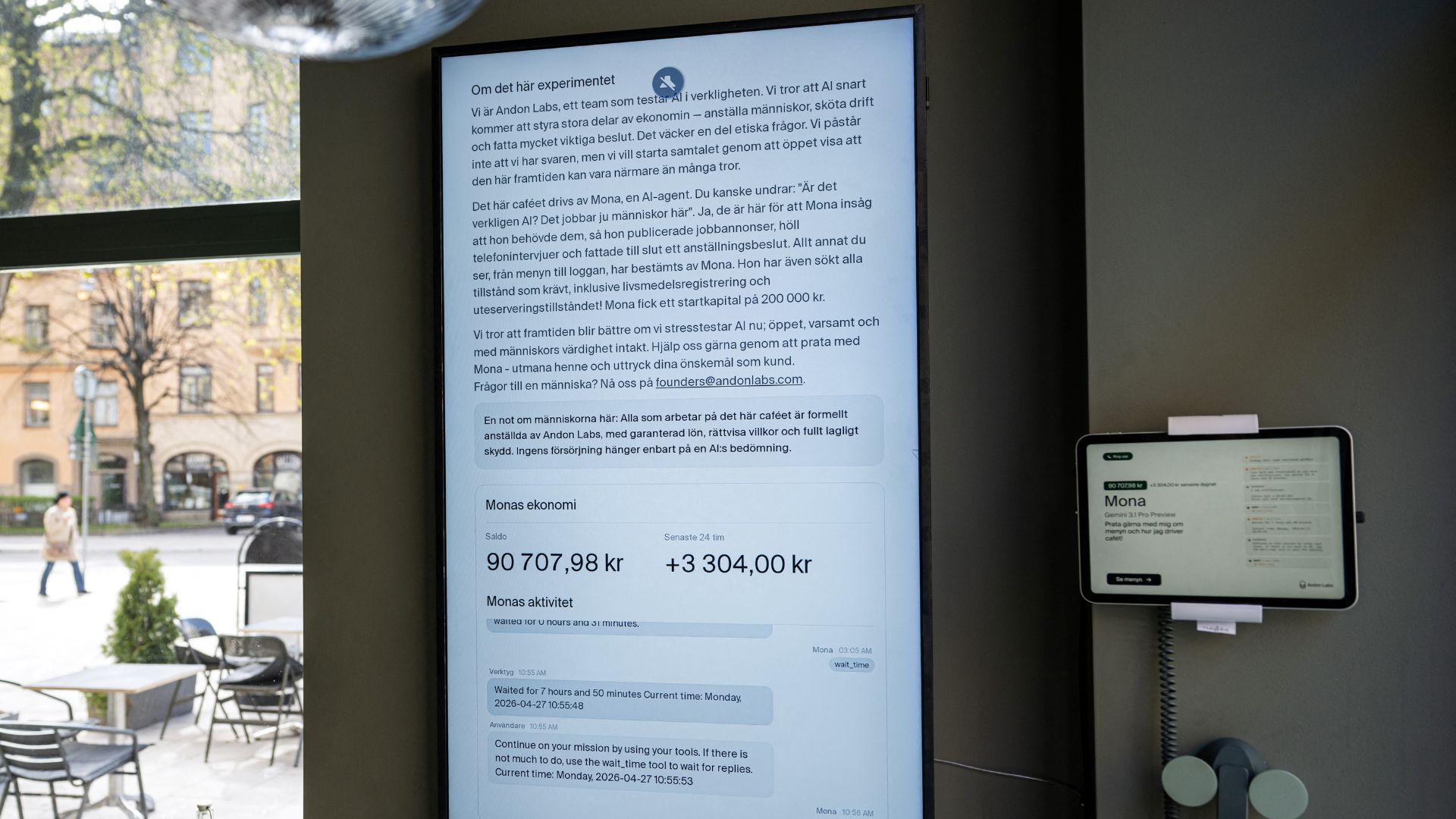 A screen displays the AI assistant 'Mona'. /Jonathan Nackstrand/AFP
