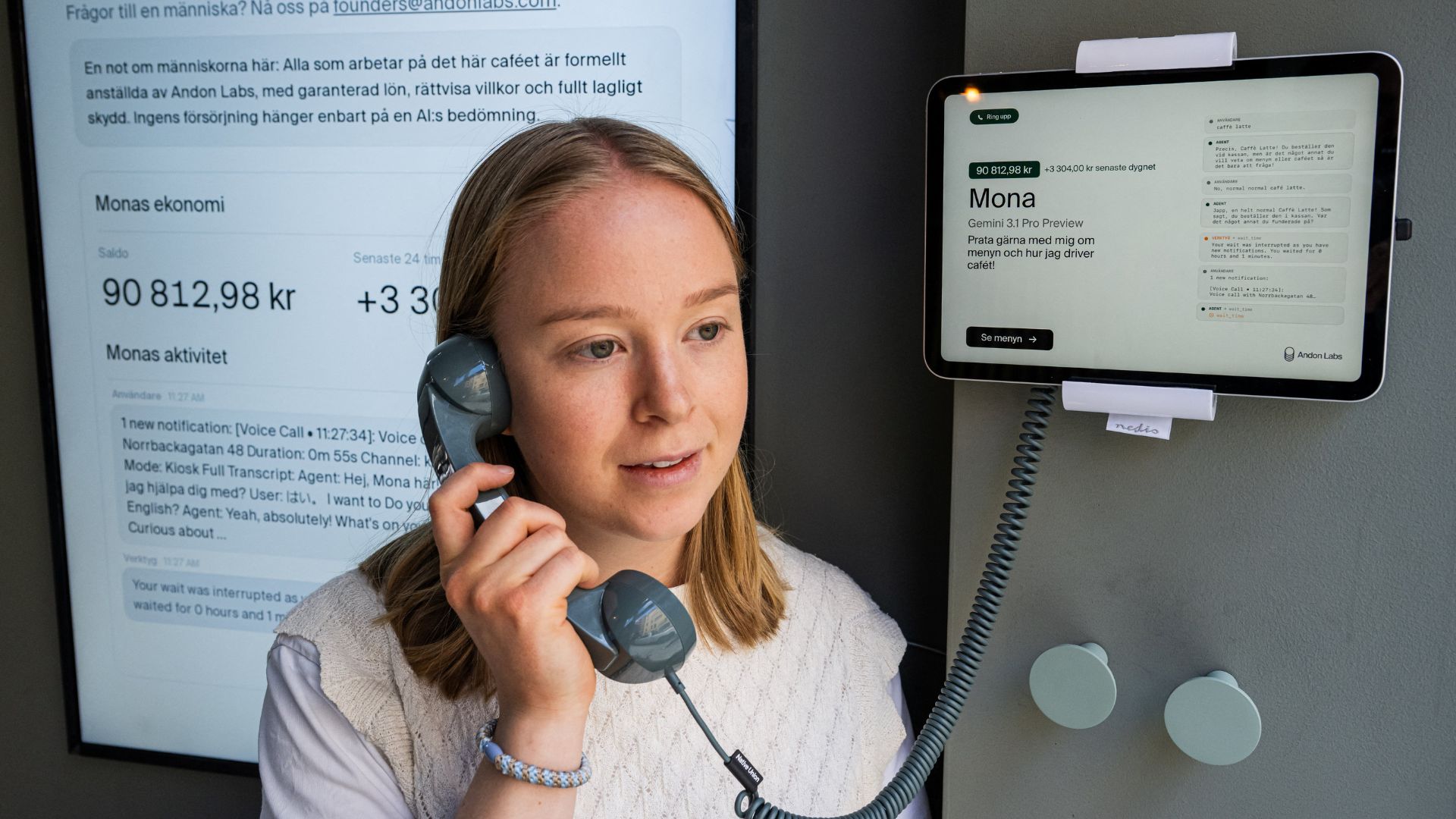 Hanna Petersson of Andon Labs' technical staff speaks with 'Mona'. /Jonathan Nackstrand/AFP
