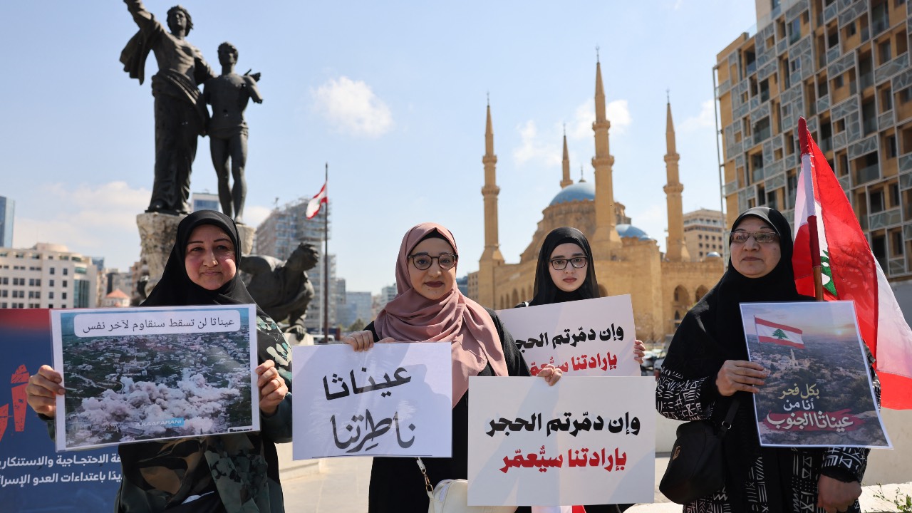 Residents and inhabitants of the devastated southern Lebanese border villages protest against the destruction of their villages and being prevented from returning by order of the Israeli army, at Martyrs' Square in central Beirut. /Anwar Amro/AFP