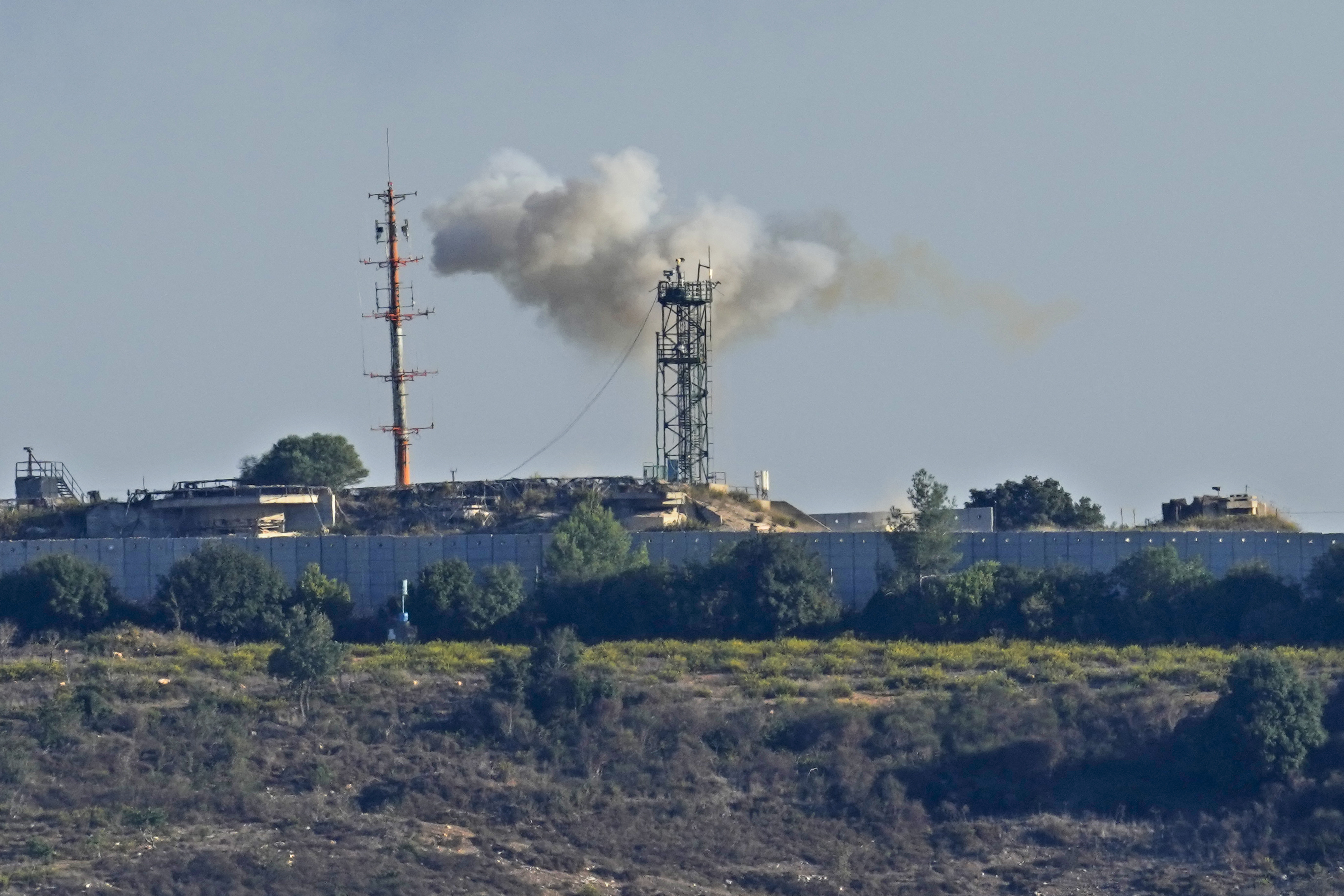 Smoke rises from inside an Israeli army position which was hit by Hezbollah fighters as seen from Tair Harfa village, a Lebanese border village with Israel, south Lebanon, on 20 October, 2023. /Hassan Ammar/AP