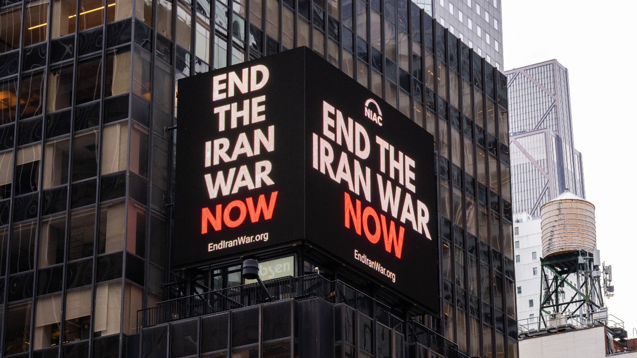 A digital billboard displays an image reading 'End the Iran war now' in Times Square in New York City. /Adam Gray/AFP