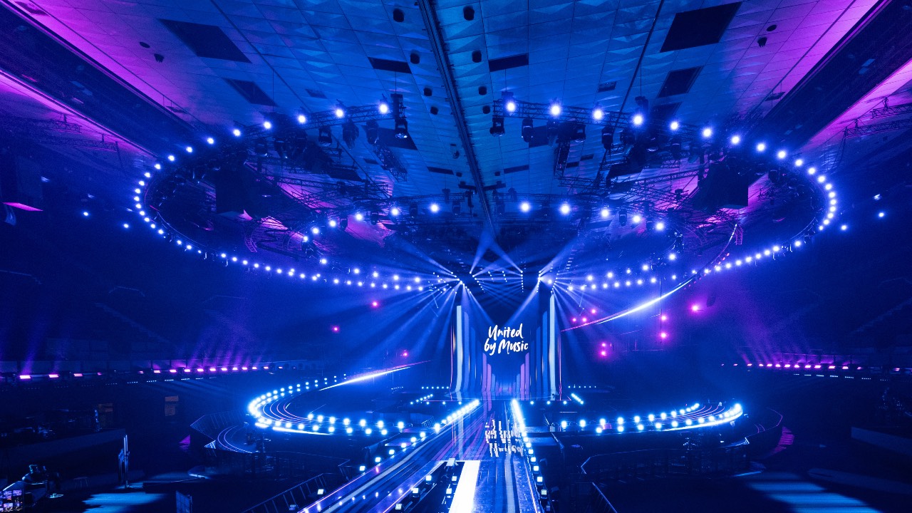 A light show and the lettering 'United by Music' are seen during the official opening of the stage for the Eurovision Song Contest (ESC) at the Wiener Stadthalle prior to the contest's 70th edition, in Vienna, Austria. /Joe Klamar/AFP