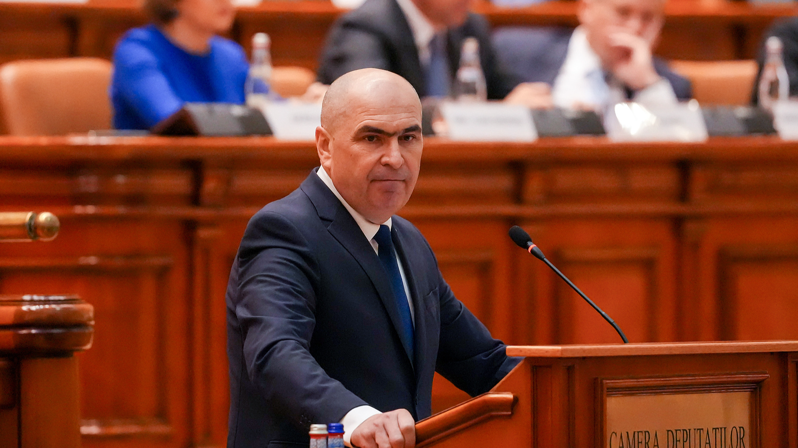 Romanian Prime Minister Ilie Bolojan addresses a parliament session ahead of a no confidence vote in Bucharest, Romania, Tuesday, May 5, 2026. /AP Photo (Vadim Ghirda)