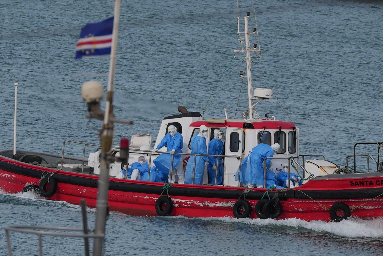 Health workers in protective gear arrive to evacuate patients from the MV Hondius cruise ship at a port in Praia, Cape Verde, Wednesday, May 6, 2026. /Misper Apawu/AP
