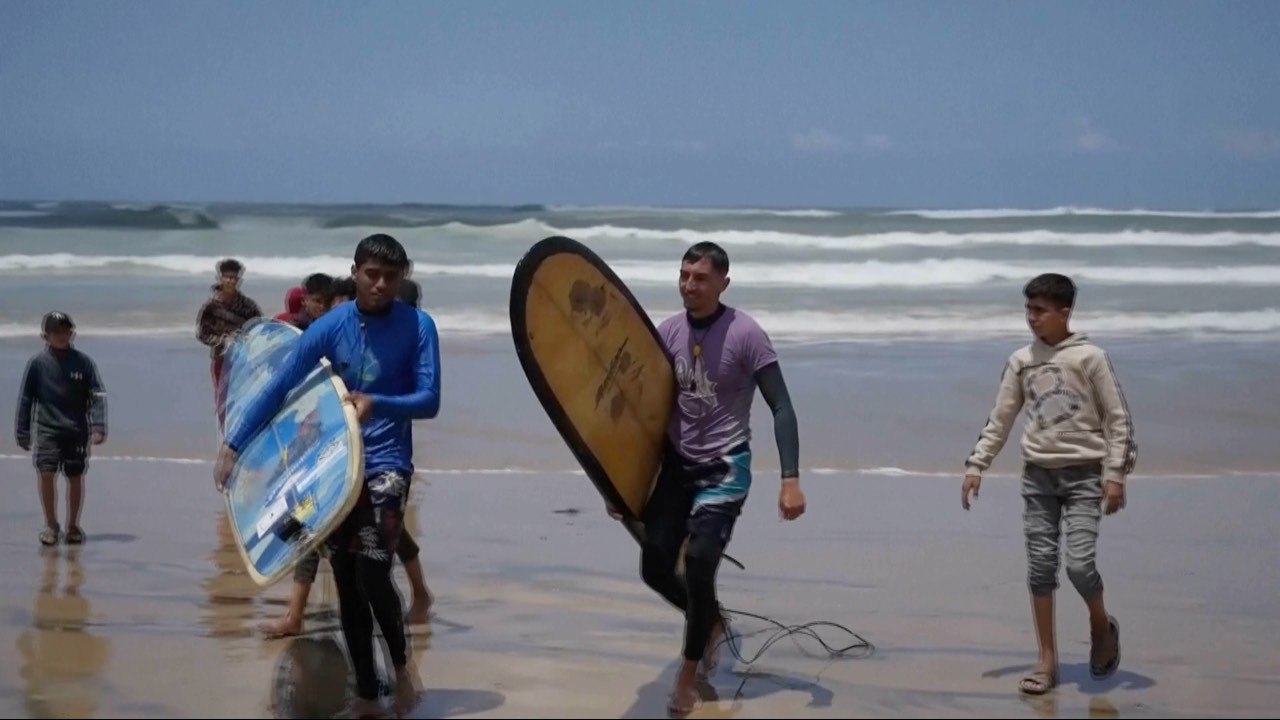 The surfers acknowledge there is constant fear but it has never been enough to keep them from the water. /AP