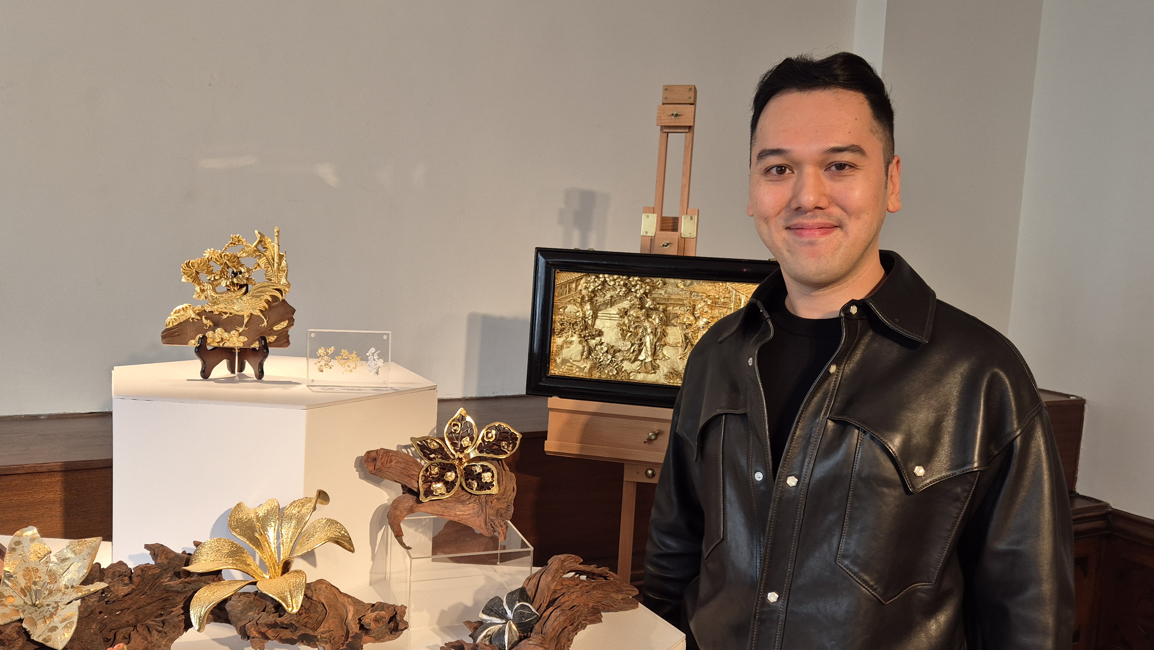 Anson Lai, goldsmith, with his gilded 3D flowers.
