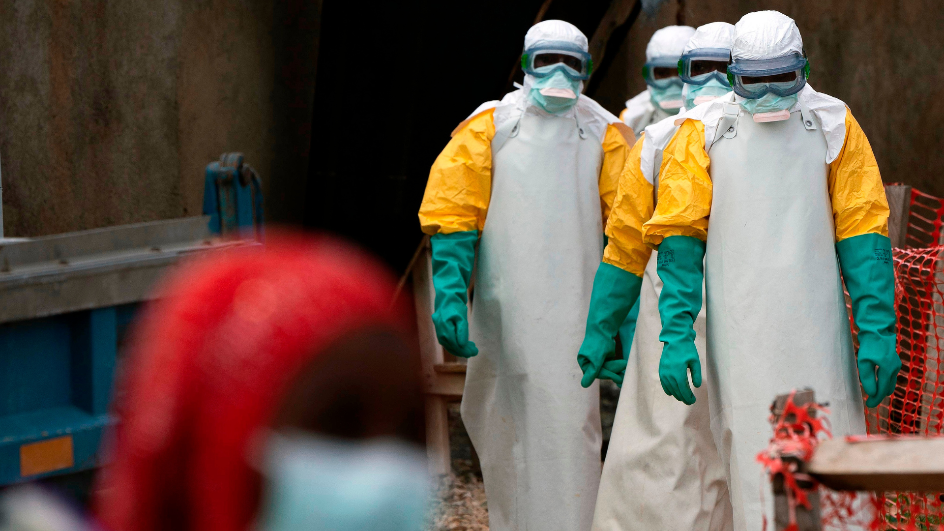 Health workers in protective gear begin their shift at an Ebola treatment center in Beni, Congo DRC from 2019./ Jerome Delay/AP